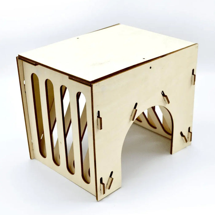 Wood box with openings for small animals to hide in with side openings for hay.