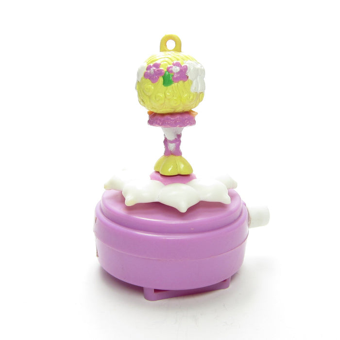 Back of Lady Slipper Wrist Dancer charm and wind up attachment