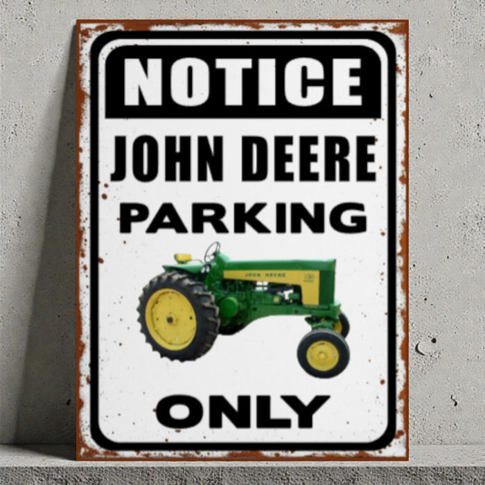 Vintage-style sign with a John Deere tractor and text 'Notice John Deere Parking Only' on a gray background.