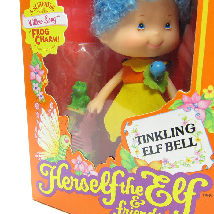 Willow Song doll with blue hair, yellow orange dress, frog wand